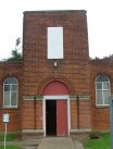 Entrance hall and water tank create a tower effect.