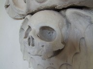 grinning winged skull