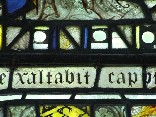 east window glass: exaltabit caput